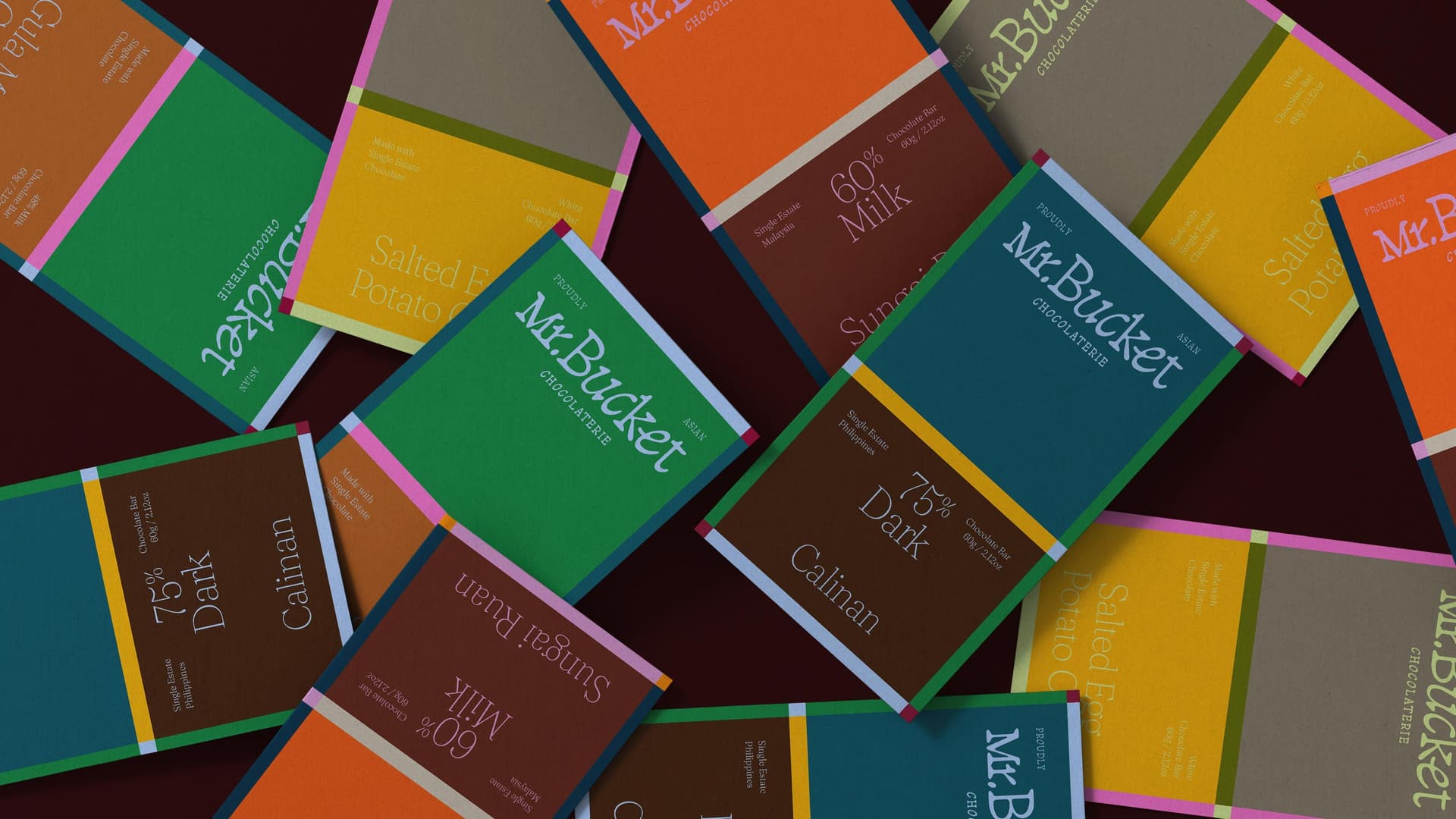 Refreshed Mr. Bucket Chocolaterie bar wrappers arranged together
